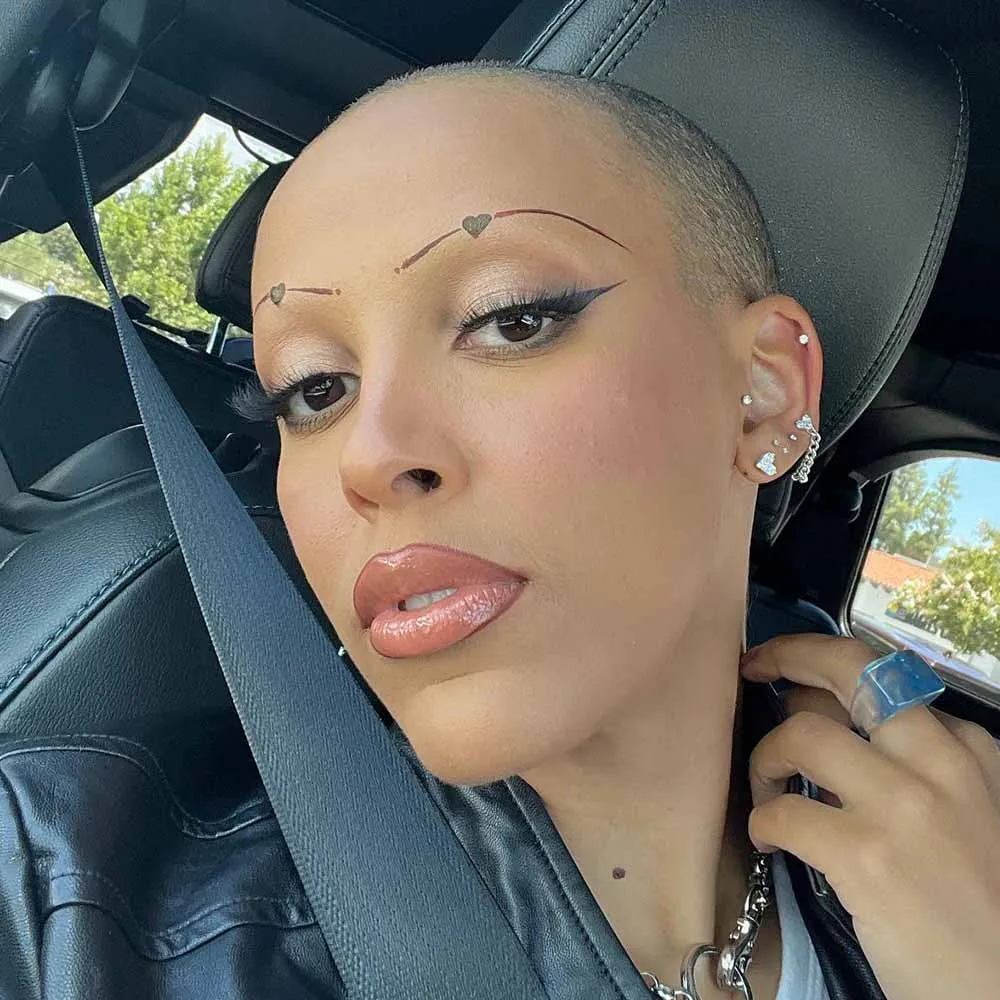 shaved eyebrows drawn on